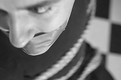 Gagged prisoner tied up with rope uid 1402469