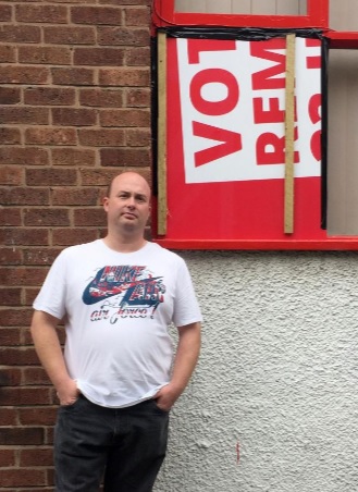 councillor-paul-stuart-in-front-of-stairwell-window